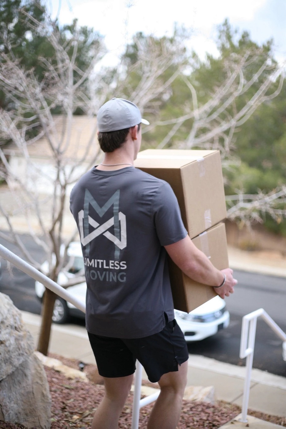 Limitless mover carrying a moving box toward the truck