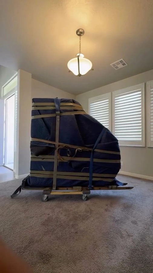 Piano padded and strapped
