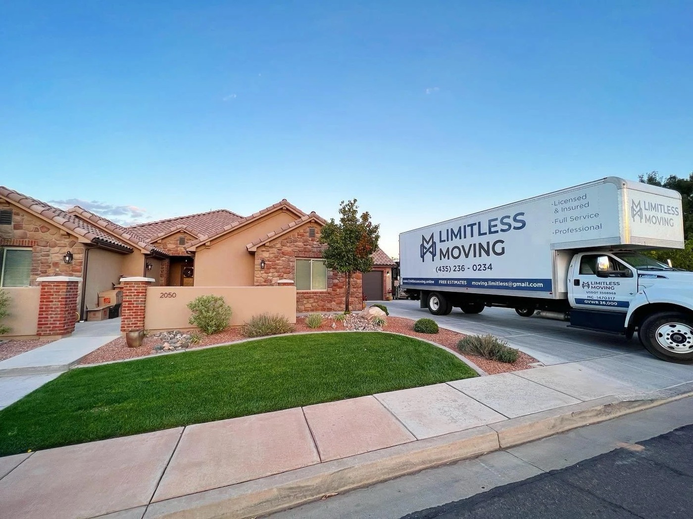 Limitless Moving truck parked at a stucco home in St. George